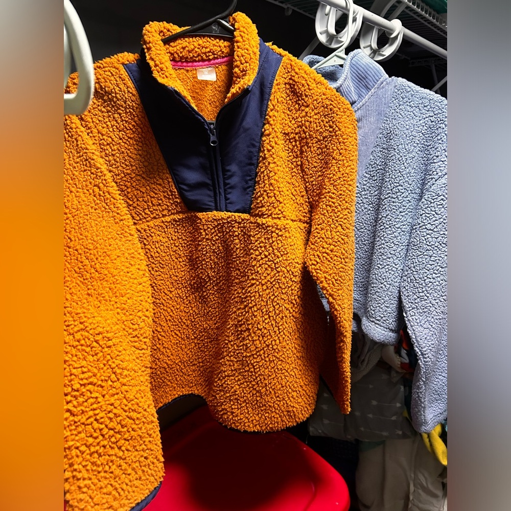 2 Sherpa like sweaters.